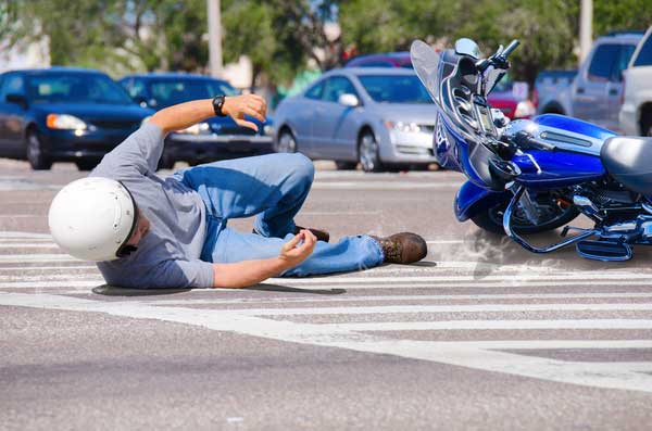 Man falls off motorcycle in traffic, College Park motorcycle accident lawyer concept