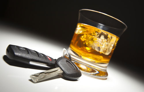 Glass of alcohol and car keys, Riverdale drunk driving accident lawyer concept