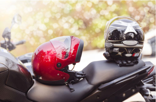 Closeup of helmet on motorcycle, Riverdale motorcycle accident lawyer concept