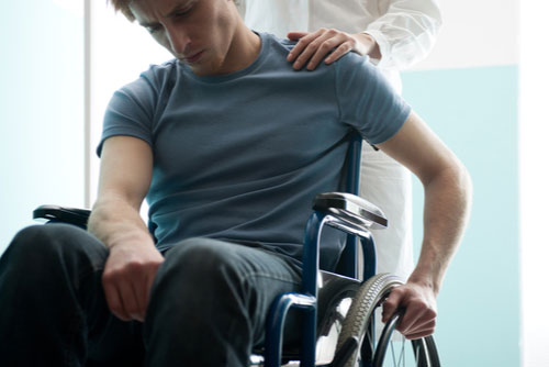 Man in a wheelchair, concept of Riverdale catastrophic injury lawyer
